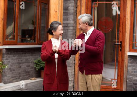 Old couple celebrating New Year Stock Photo