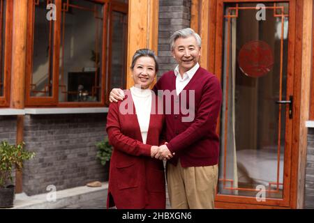 Old couple celebrating New Year Stock Photo