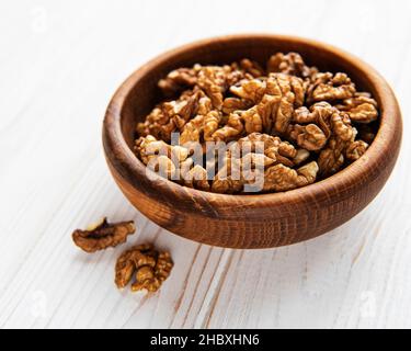 Walnuts  without shell on a white wooden background Stock Photo