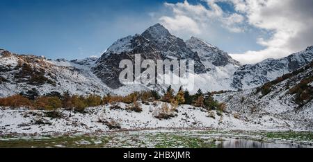 travel to Caucasus mountains in Karachay-Cherkessia, Arkhyz. Beautiful Autumn mountain landscapes, snow caps on tops of mountains. the road to Lake Orlyonok from Taulu glade Stock Photo