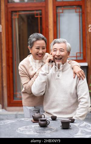 Old couple using a smartphone Stock Photo