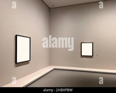 Two empty frames on the wall of a museum Stock Photo