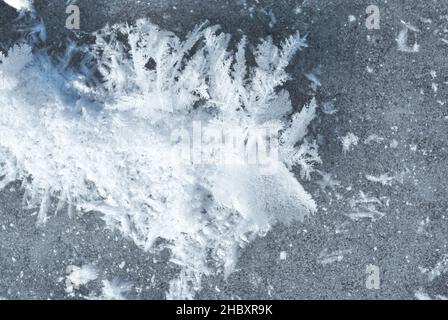 Ice surface with large fluffy snowflakes, natural organic background, top view Stock Photo