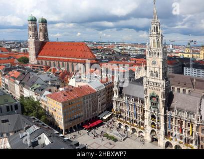 Bell towers of the Cathedral and the town hall in the gothic style of the city of Munich in Germany in the region Bavaria from above Stock Photo