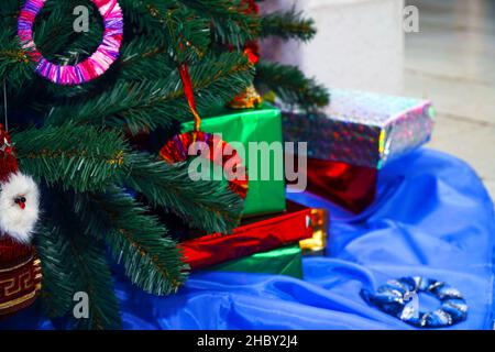 Christmas and New Year gifts in beautiful boxes under the Christmas tree Stock Photo