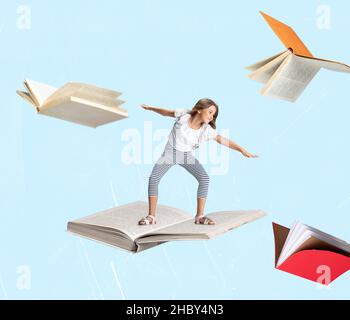 Contemporary art collage of little cheerful girl, child surfing on open book isolated over light blue background Stock Photo