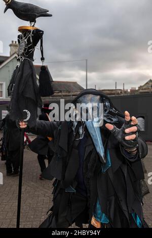 A masked participant in the Montol Festival parade; in Penzance in Cornwall. The festival is a revival or reinterpretation of many of the traditional Stock Photo