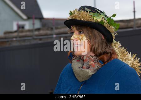 A participant in the Montol Festival parade; in Penzance in Cornwall. The festival is a revival or reinterpretation of many of the traditional Cornish Stock Photo