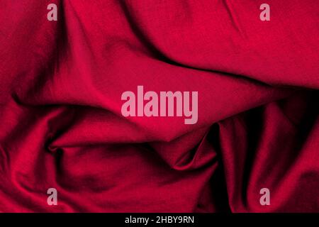 Close up top view of folded red cloth with texture for fabric background Stock Photo