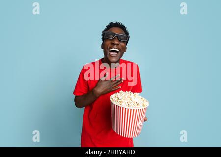 Cinema Fun. Laughing Black Guy In 3d Glasses With Popcorn In Hands Stock Photo