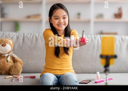 Happy little asian girl beauty blogger live video streaming Stock Photo