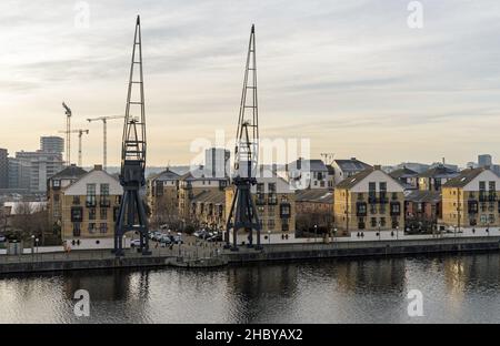 Old shipping container cranes at the Royal Victoria Docks in London's East End. London - 22nd December 2021 Stock Photo