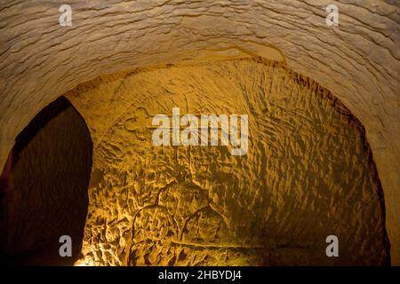 Carved cross, Grotte del Cantinone, Osimo, Province of Ancona, Italy Stock Photo