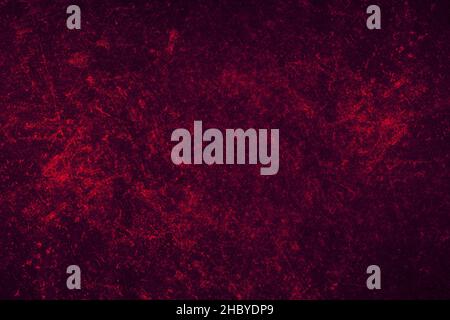 Red grunge textures on a dark metal sheet with scratches for background Stock Photo