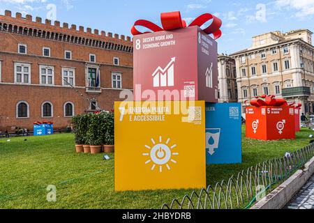 ROME,  ITALY. 22 December 2021. A collection of 17 interlinked sustainable development global goals designed to achieve a better and more sustainable future for all  written on large gift boxes including climate action, reduced inequalities, sustainable cities and inequalities, no poverty, gender equality, decent work and economic growth . Credit: amer ghazzal/Alamy Live News Stock Photo