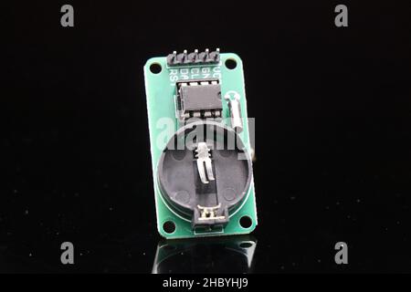 Real time clock module or RTC module for timekeeping used in creative electronic projects isolated on black background Stock Photo