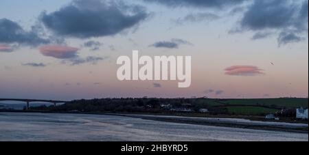 Pink sunset evening over East the Water and Torridge Estuary in North Devon, England. Stock Photo