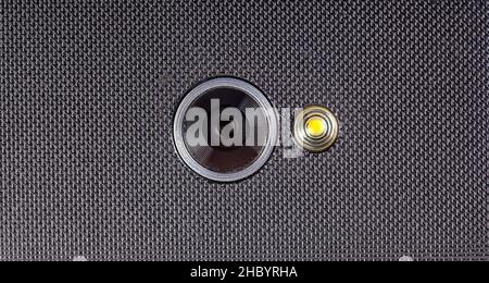 Mobile phone, single smartphone camera lens with an LED flash light object macro, detail, extreme closeup, nobody. Modern phone cam up close, recordin Stock Photo
