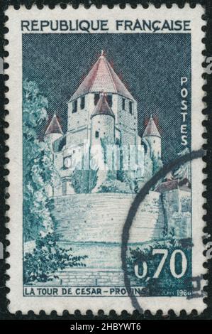 POLTAVA, UKRAINE -Desember 22 , 2021. Vintage stamp printed in France circa 1964 shows Cesar Tower Stock Photo