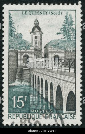 POLTAVA, UKRAINE -Desember 22 , 2021. Vintage stamp printed in France circa 1957 shows Le Quesnoy Stock Photo