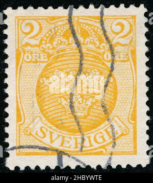POLTAVA, UKRAINE -Desember 22 , 2021. Vintage stamp printed in Sweden circa 1910 shows coat of arms Stock Photo
