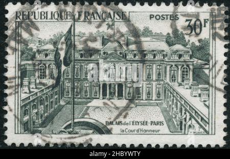 POLTAVA, UKRAINE -Desember 22 , 2021. Vintage stamp printed in France circa 1959 shows Elysee Palace Stock Photo