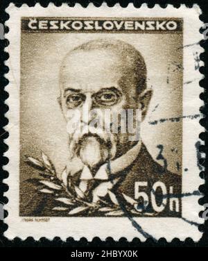 POLTAVA, UKRAINE - Desember 22, 2021. Vintage stamp printed in Czechoslovakia circa 1945 shows President Masaryk Stock Photo