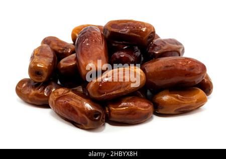 Dates close-up on a white background. Isolate of a bunch of dates. Dried fruits Stock Photo