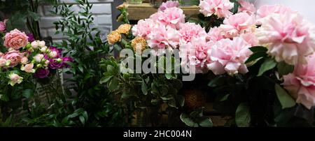 fresh cut roses in delicate tones in a flower shop Stock Photo