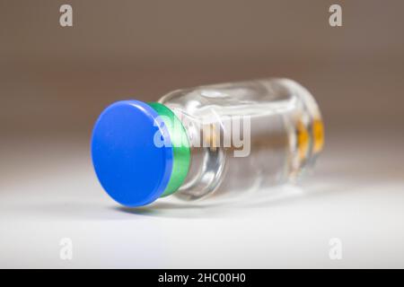 unopened vial bottle laying on the ground Stock Photo