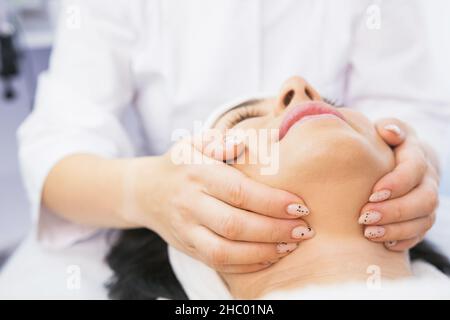 Close-up photo of woman getting facial hydro microdermabrasion peeling treatment in cosmetic beauty spa clinic. Stock Photo