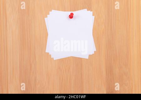 White Sticky Notes with Copyspace Pinned to the Wooden Message Board. To Do List Reminder in Office. Blank Memo Stickers at Work - Template. Empty Checklist - Mockup Stock Photo
