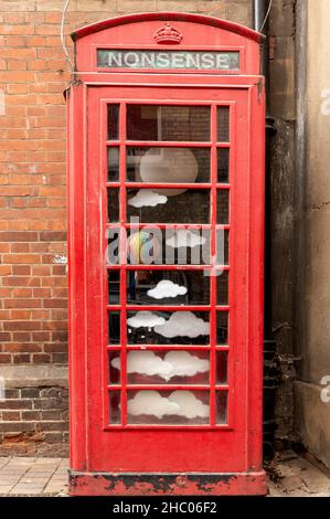 Old K6 Grade II listed red telephone box converted into art installation outside the Story Museum in Pembroke Street, Oxford, Oxfordshire, England, UK Stock Photo