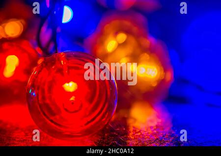 Colored globe lights lay on a table, Dec. 27, 2017, in Coden, Alabama. Globe-style string lights can be used inside or outdoors for a festive touch. Stock Photo