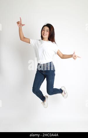 The Asian womna standing on the white background. Stock Photo