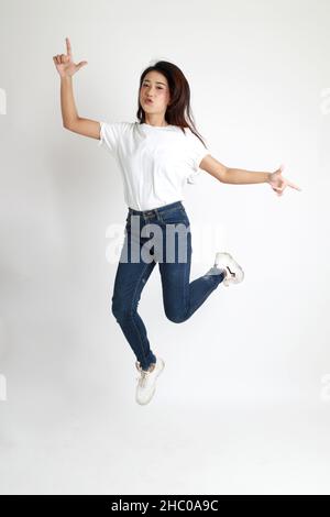 The Asian womna standing on the white background. Stock Photo