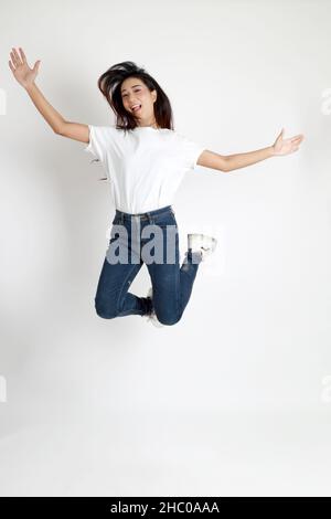 The Asian womna standing on the white background. Stock Photo