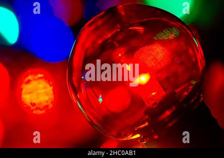 Colored globe lights lay on a table, Dec. 27, 2017, in Coden, Alabama. Globe-style string lights can be used inside or outdoors for a festive touch. Stock Photo