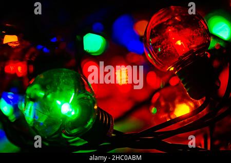 Colored globe lights lay on a table, Dec. 27, 2017, in Coden, Alabama. Globe-style string lights can be used inside or outdoors for a festive touch. Stock Photo