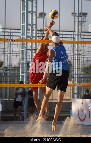 IZMIR, TURKEY - JULY 10, 2021: Russia (Komissarenko and Rukhmanov) vs Norway (Mol, M. and Sunde) Quarterfinal match of CEV U20 Beach Volleyball Europe Stock Photo