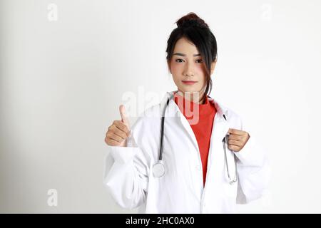 The Asian womna standing on the white background. Stock Photo