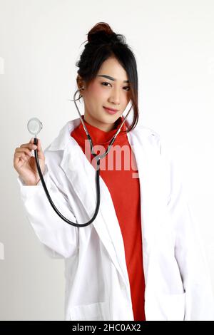 The Asian womna standing on the white background. Stock Photo
