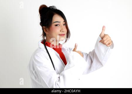 The Asian womna standing on the white background. Stock Photo