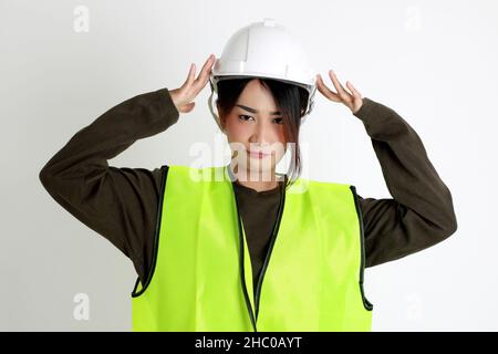 The Asian womna standing on the white background. Stock Photo