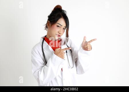 The Asian womna standing on the white background. Stock Photo