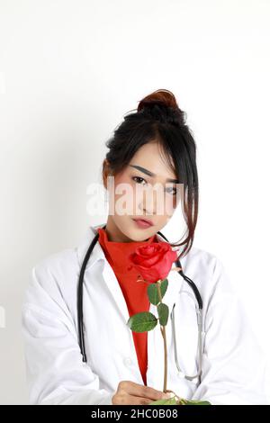The Asian womna standing on the white background. Stock Photo