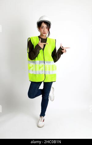 The Asian womna standing on the white background. Stock Photo