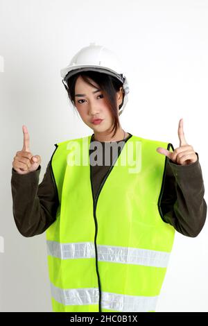 The Asian womna standing on the white background. Stock Photo