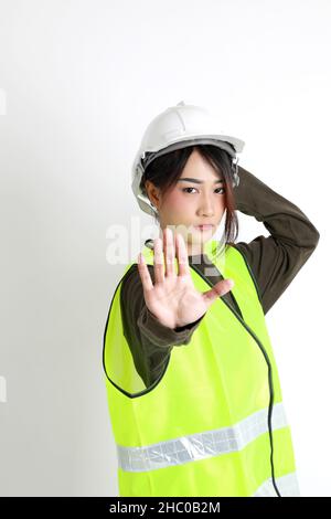 The Asian womna standing on the white background. Stock Photo