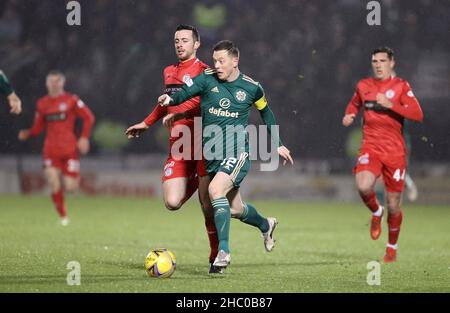 Celtic’s Callum McGregor in action with St Mirren's Joe Shaughnessy during the cinch Premiership match at the SMISA Stadium, Paisley. Picture date: Wednesday December 22, 2021. Stock Photo